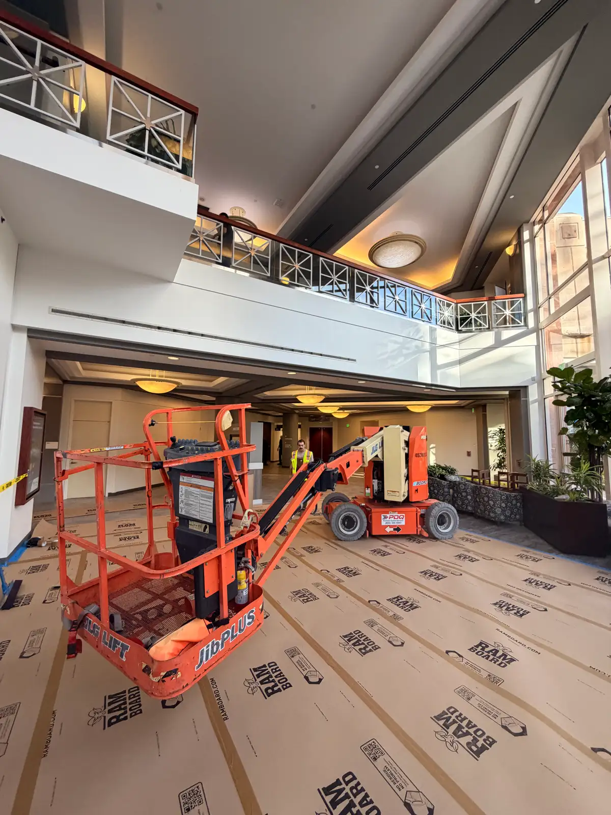 Mainline Plumbing crew on a high-reach lift performing overnight commercial plumbing at Providence St. Joseph Hospital