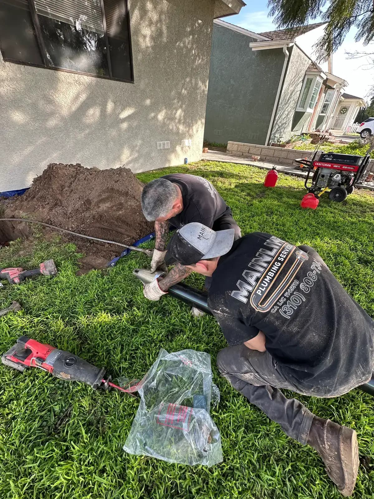 Mainline Plumbing trenchless pipe bursting at a South Bay residential property with the yard left intact