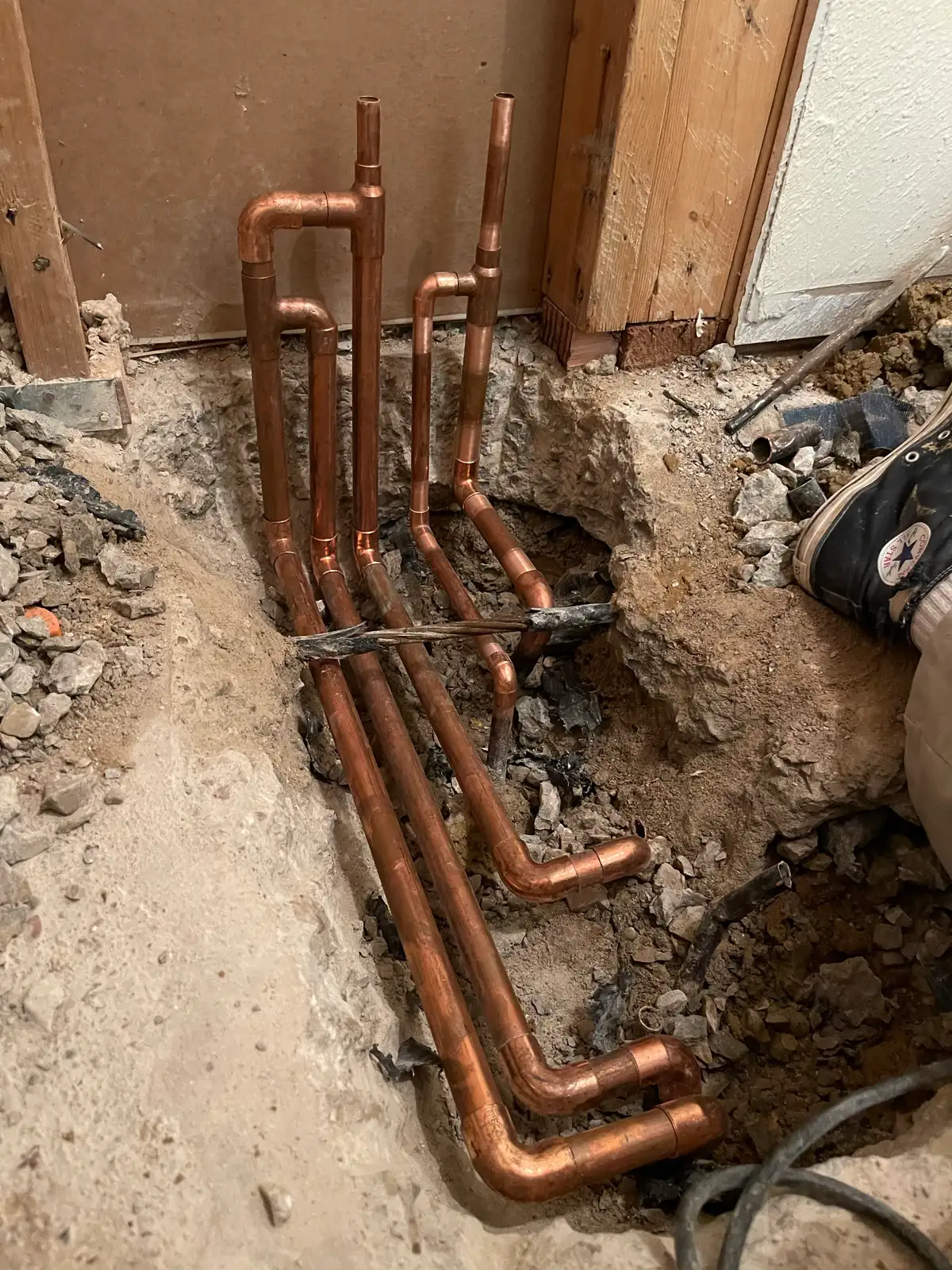 Mainline Plumbing slab-leak reroute manifold install — serving Lawndale, California